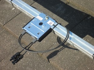 Solaredge power optimiser mounted behind solar panel